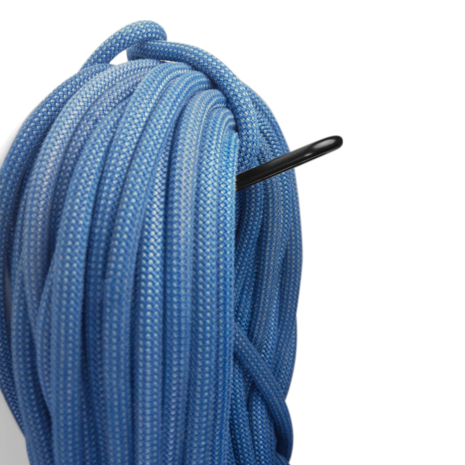 Coiled blue rope with a black hook on a white background